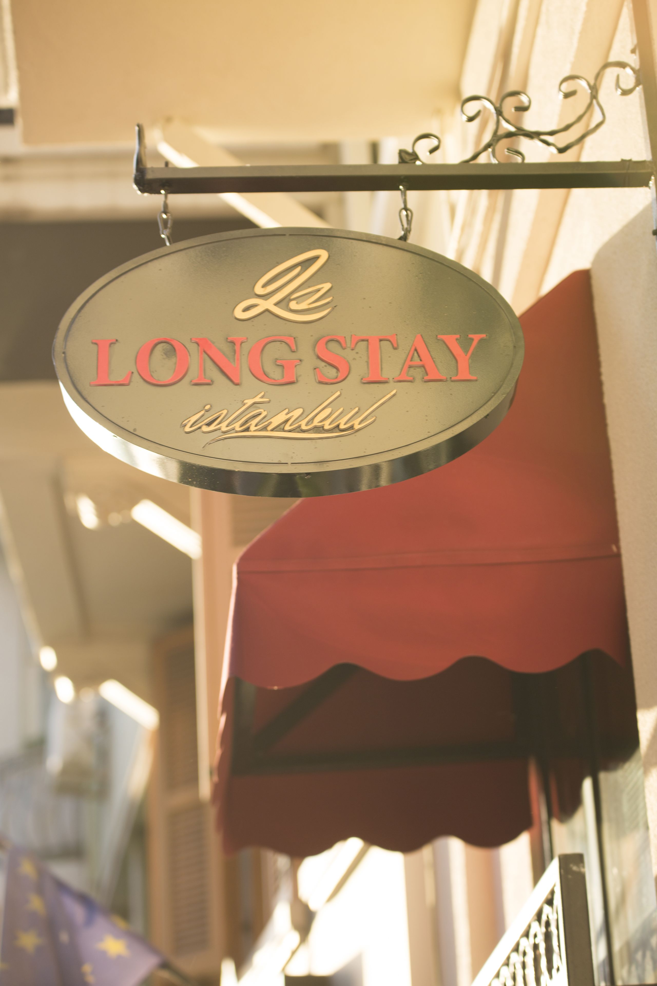 A hanging sign with the text "Le LONGSTAY istanbul".