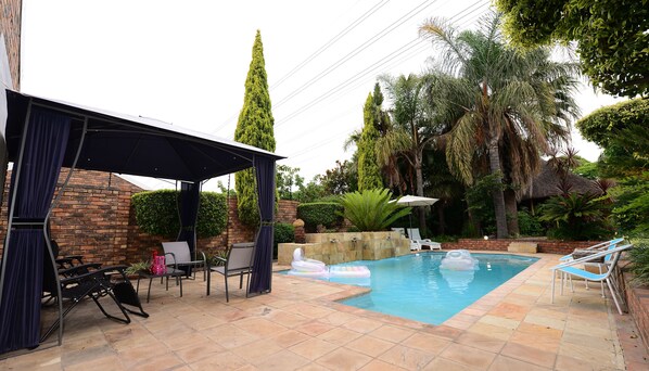 Outdoor pool, pool umbrellas, sun loungers