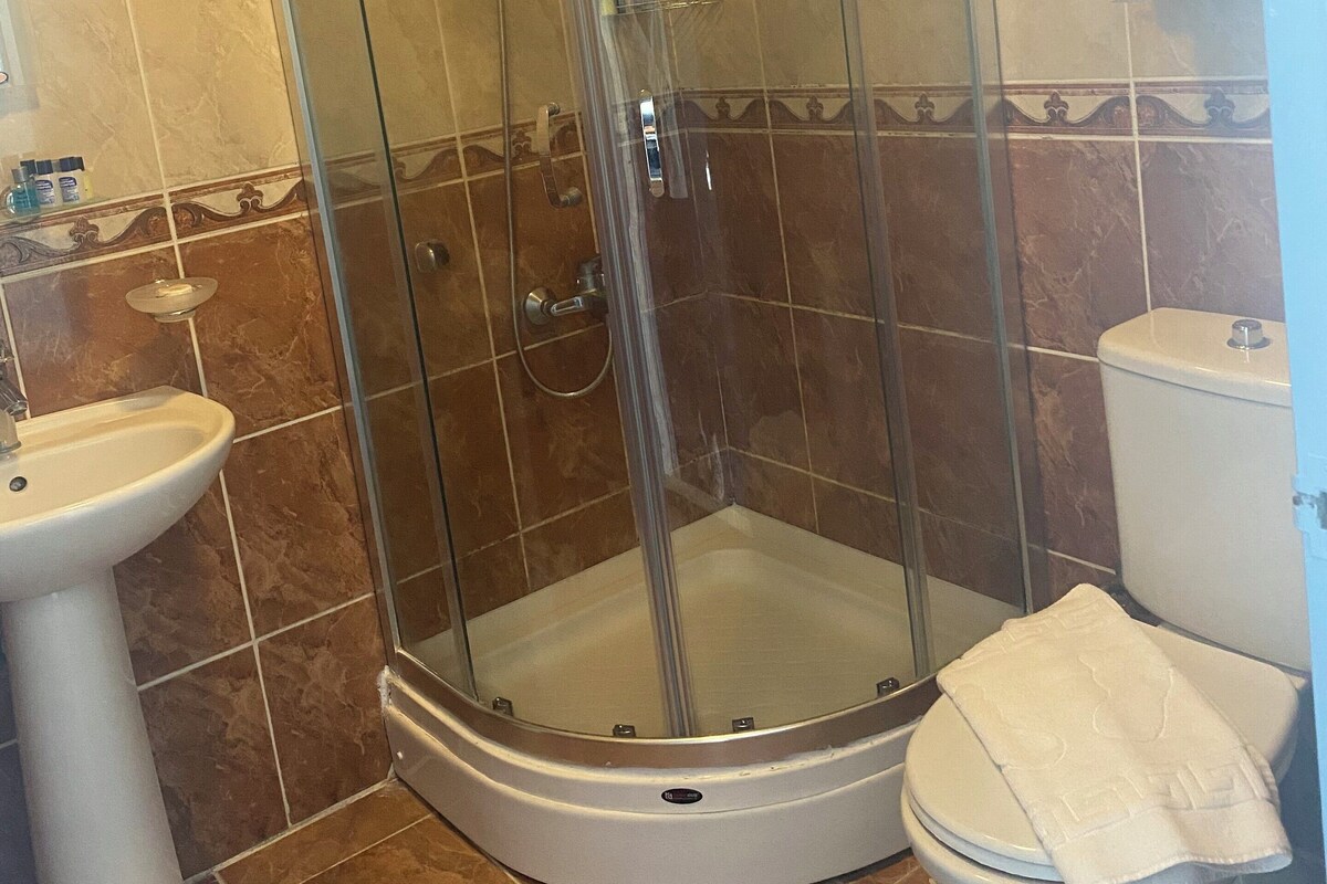 Shower, free toiletries, hair dryer, slippers