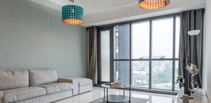 Deluxe Apartment | Living area | Flat-screen TV