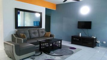 Basic Apartment, 3 Bedrooms | Living room | LCD TV