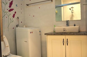 Shower, free toiletries, hair dryer, slippers