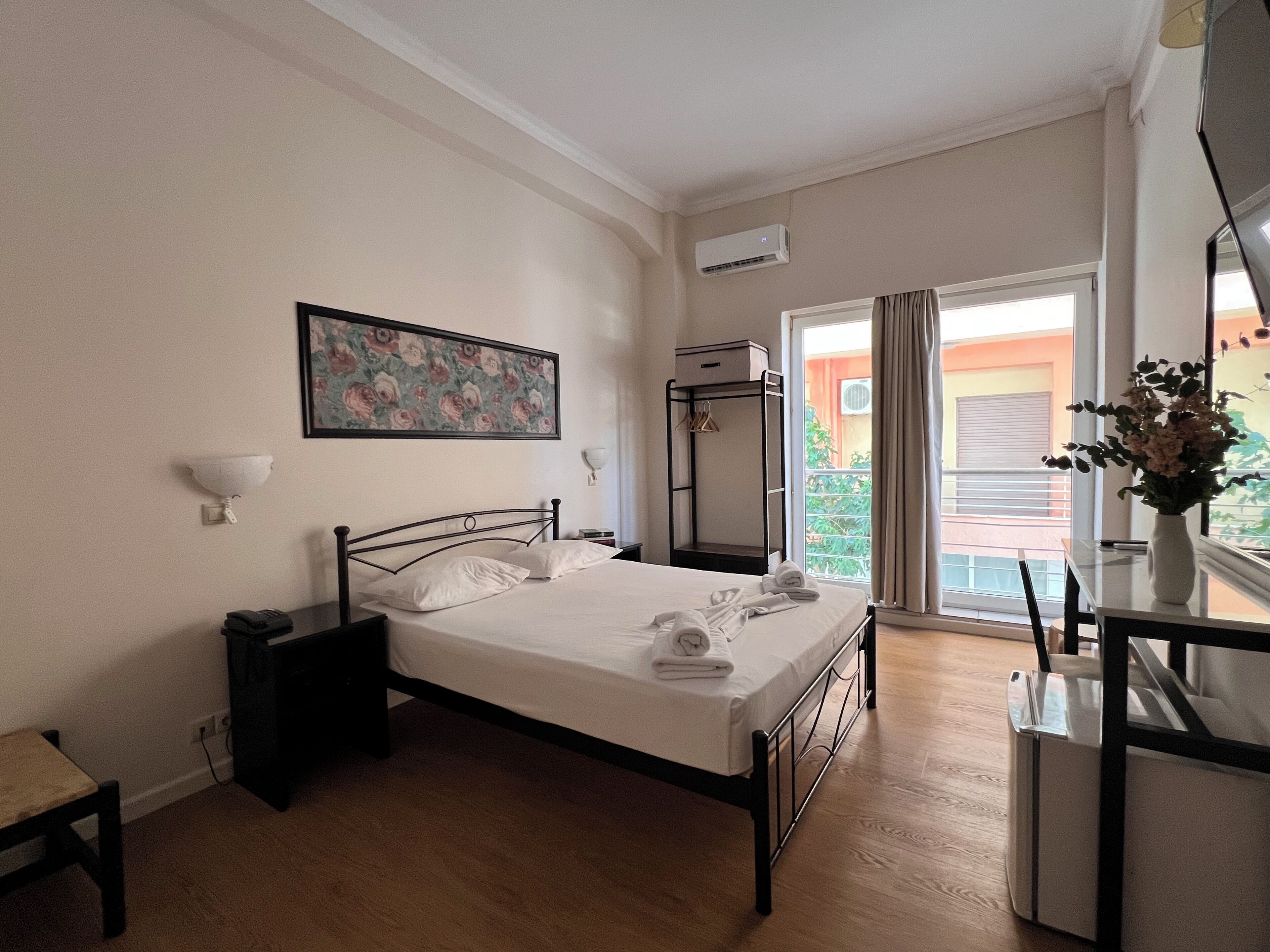 Basic Double or Twin Room | Desk, laptop workspace, blackout drapes, iron/ironing board