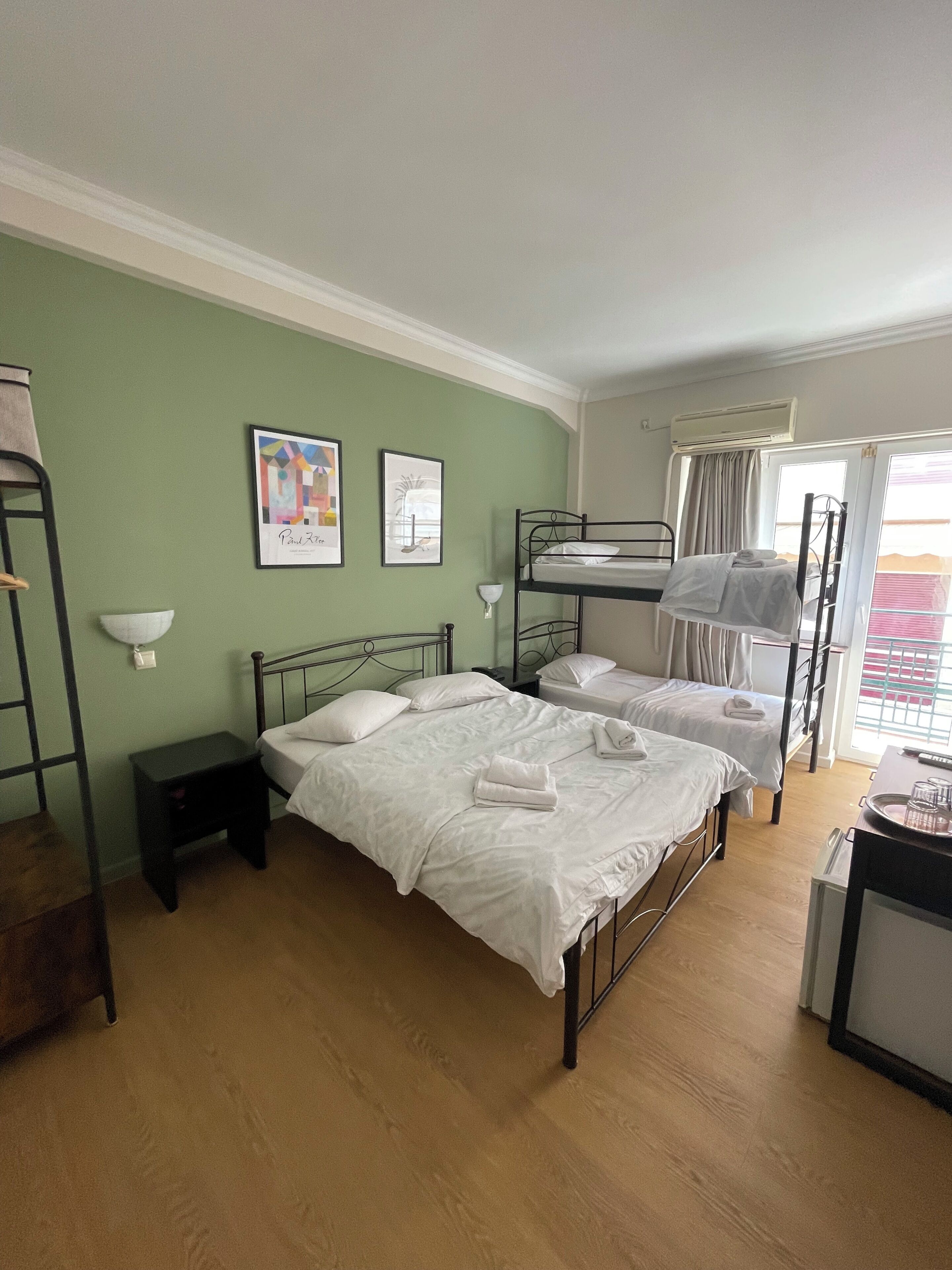 Family Quadruple Room | Desk, laptop workspace, blackout drapes, iron/ironing board