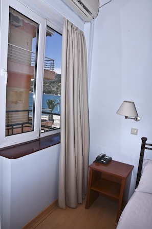 Basic Single Room | Desk, laptop workspace, blackout drapes, iron/ironing board