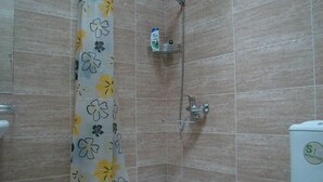 A bathroom with a shower, toilet, and a sink. - Tiflisi Guest House - Hostel (Tbilisi)