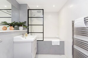 Apartment, 2 Bedrooms | Bathroom | Combined shower/tub, deep soaking tub, free toiletries, hair dryer