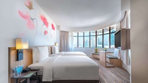 A hotel room with two beds, a desk, a TV, and a large window with a city view. - Hilton Garden Inn Kuala Lumpur Jalan Tuanku Abdul Rahman South (Kuala Lumpur)
