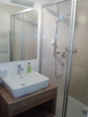 Apartment, 1 Bedroom, Mountain View (Molly) | Bathroom | Shower, hair dryer, slippers, towels - Haus Alpenrose (Waidring)