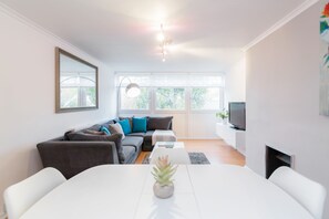 Apartment, 3 Bedrooms | Living area | Flat-screen TV