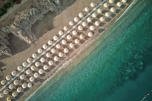 On the beach, sun-loungers, beach umbrellas, beach towels