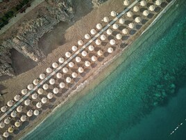 On the beach, sun loungers, beach umbrellas, beach towels