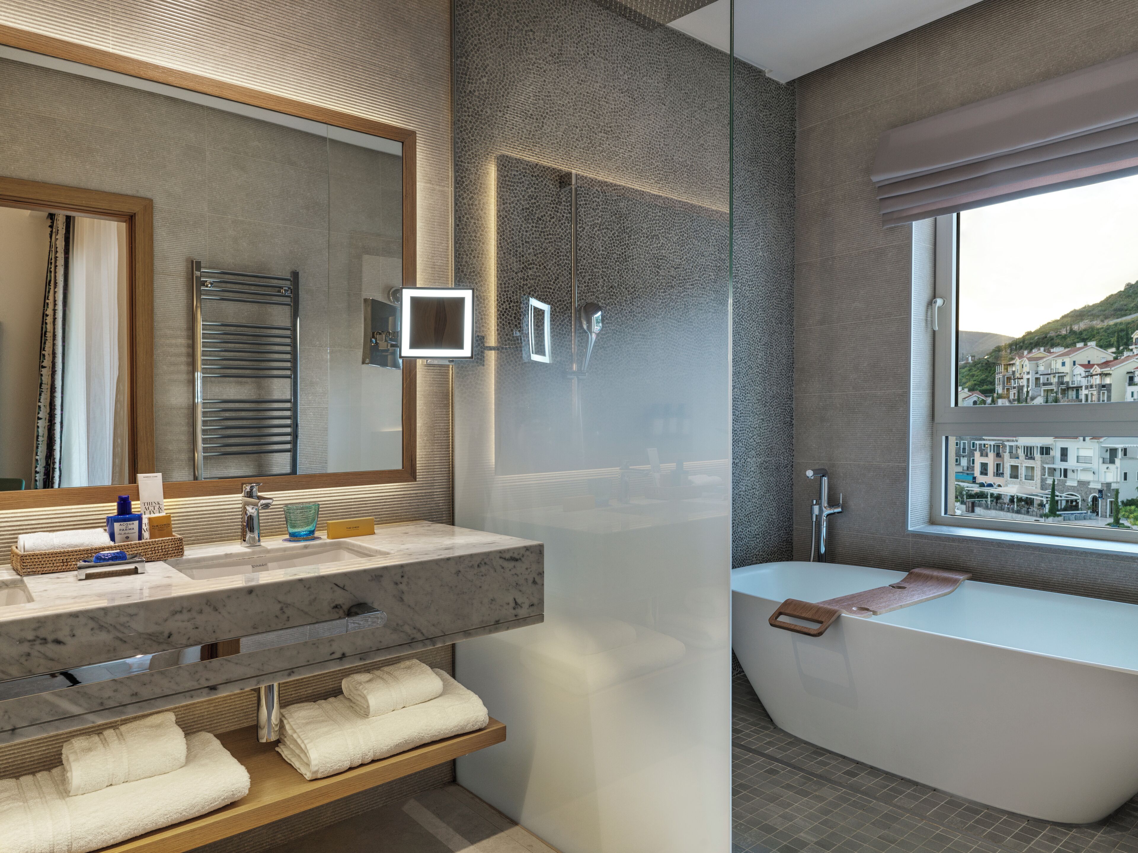 designer toiletries, hair dryer, bathrobes, slippers