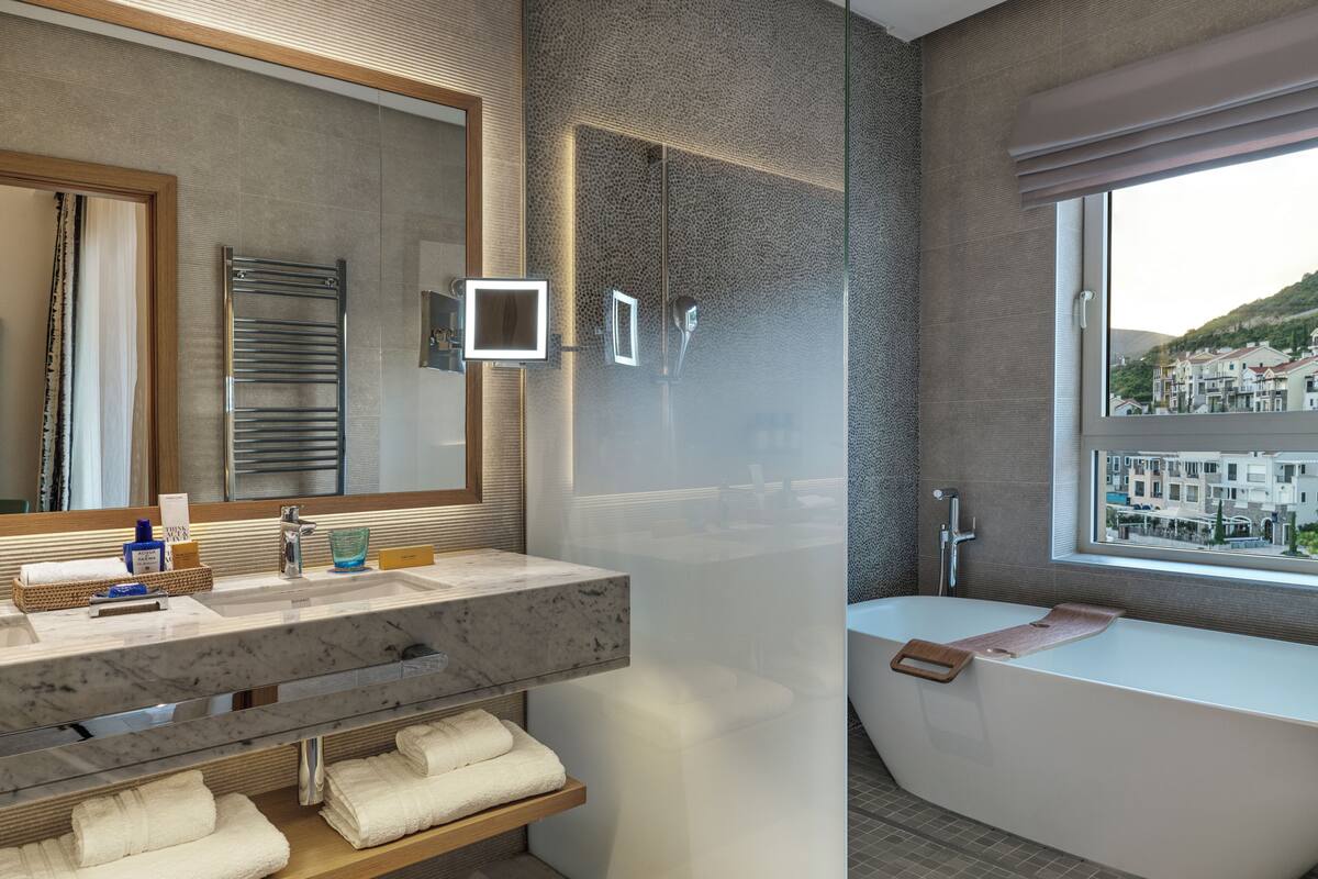 designer toiletries, hair dryer, bathrobes, slippers