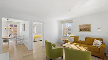 Deluxe Apartment, 1 Bedroom, Kitchen | Living area | 30-inch TV with cable channels