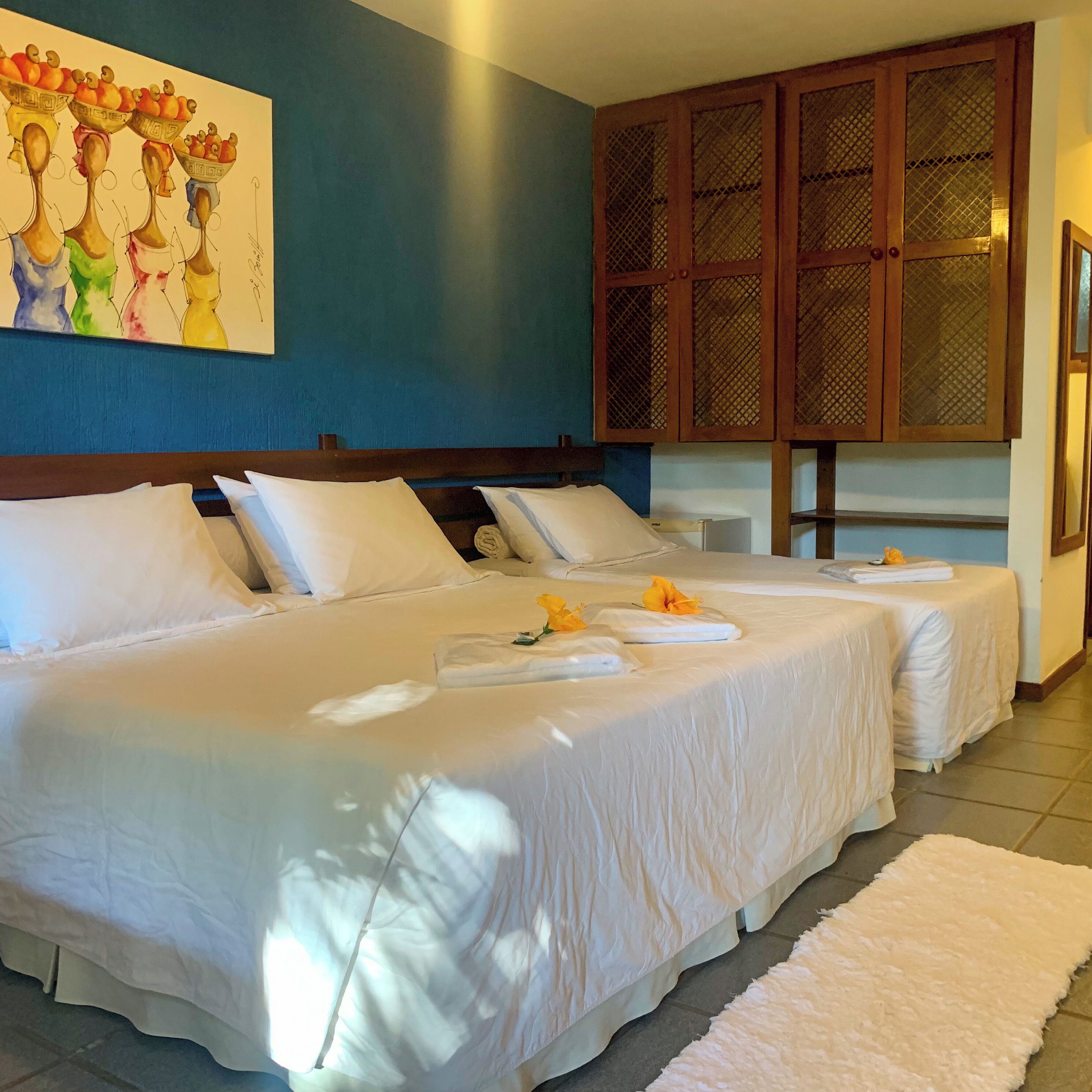 quadruple room, lanai, garden view | minibar, in-room safe, iron/ironing board, free wifi