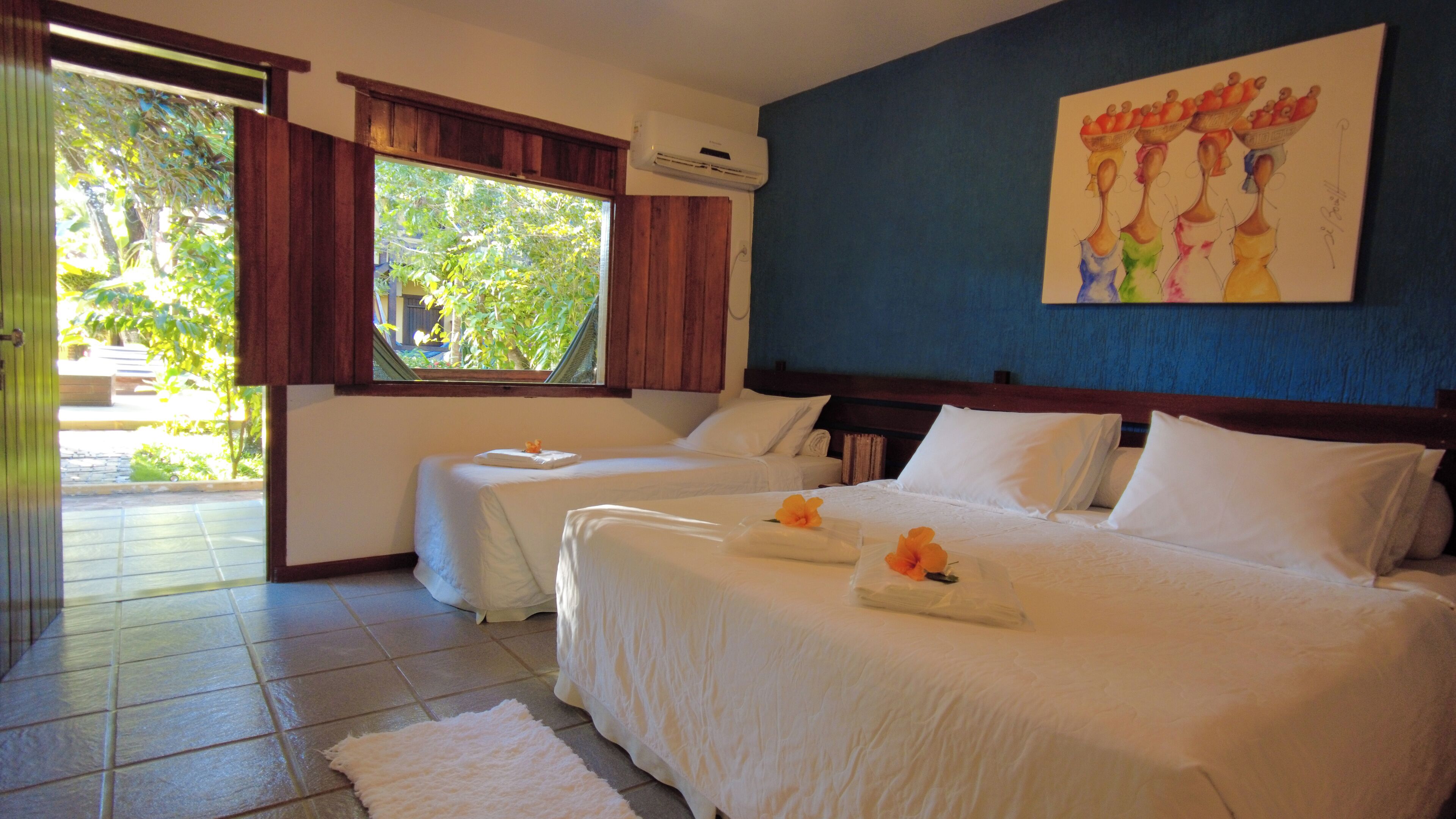 quadruple room, lanai, garden view | minibar, in-room safe, iron/ironing board, free wifi