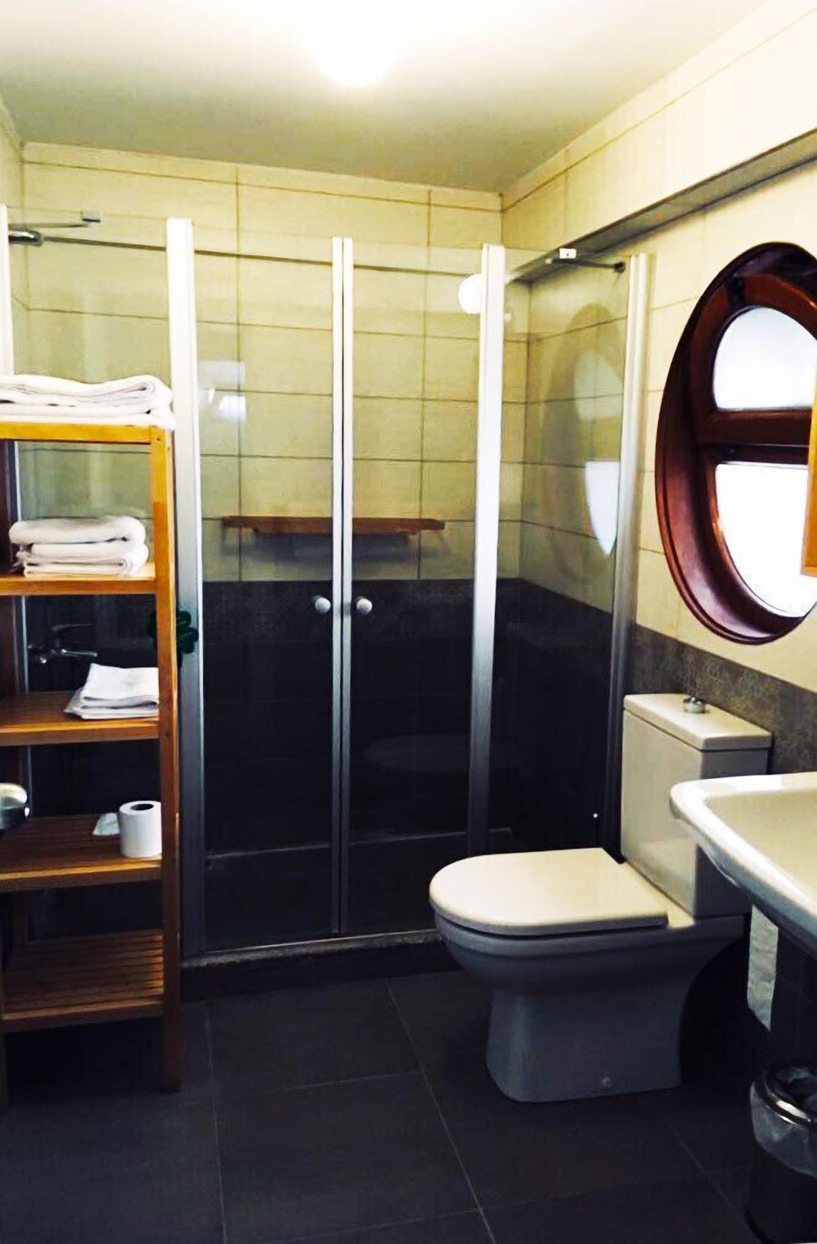 family triple room | bathroom | shower, hair dryer, slippers, towels