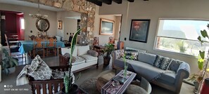 Deluxe House, 4 Bedrooms | Living area | Flat-screen TV, fireplace - Casa Laderas de Chacras de Coria (Chacras de Coria)