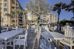 Relax on the patio surrounded by palm trees and enjoy dining or socializing with friends and family.