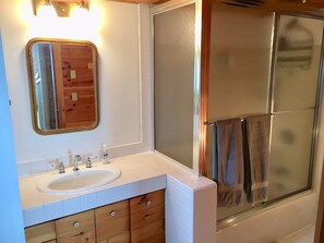 Combined shower/tub, hair dryer, towels, soap