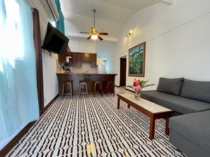 Deluxe Apartment, 2 Bedrooms, Ocean View | Living area | Flat-screen TV