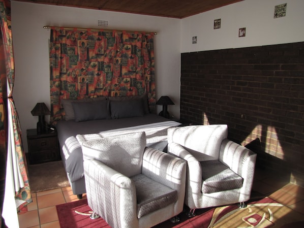 Suite estudio básica, 1 habitación, vista a la alberca | 1 habitación, ropa de cama de alta calidad y muebles diferentes