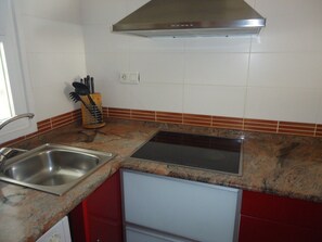 Fridge, microwave, coffee/tea maker, cookware/dishes/utensils