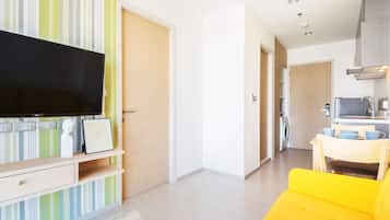 One Bedroom Condo | Living area | Flat-screen TV