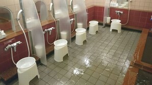 A public restroom with multiple urinals, hand dryers, and a sink area. - ATSUGI CAPSULEHOTEL – Caters to Men (Atsugi)