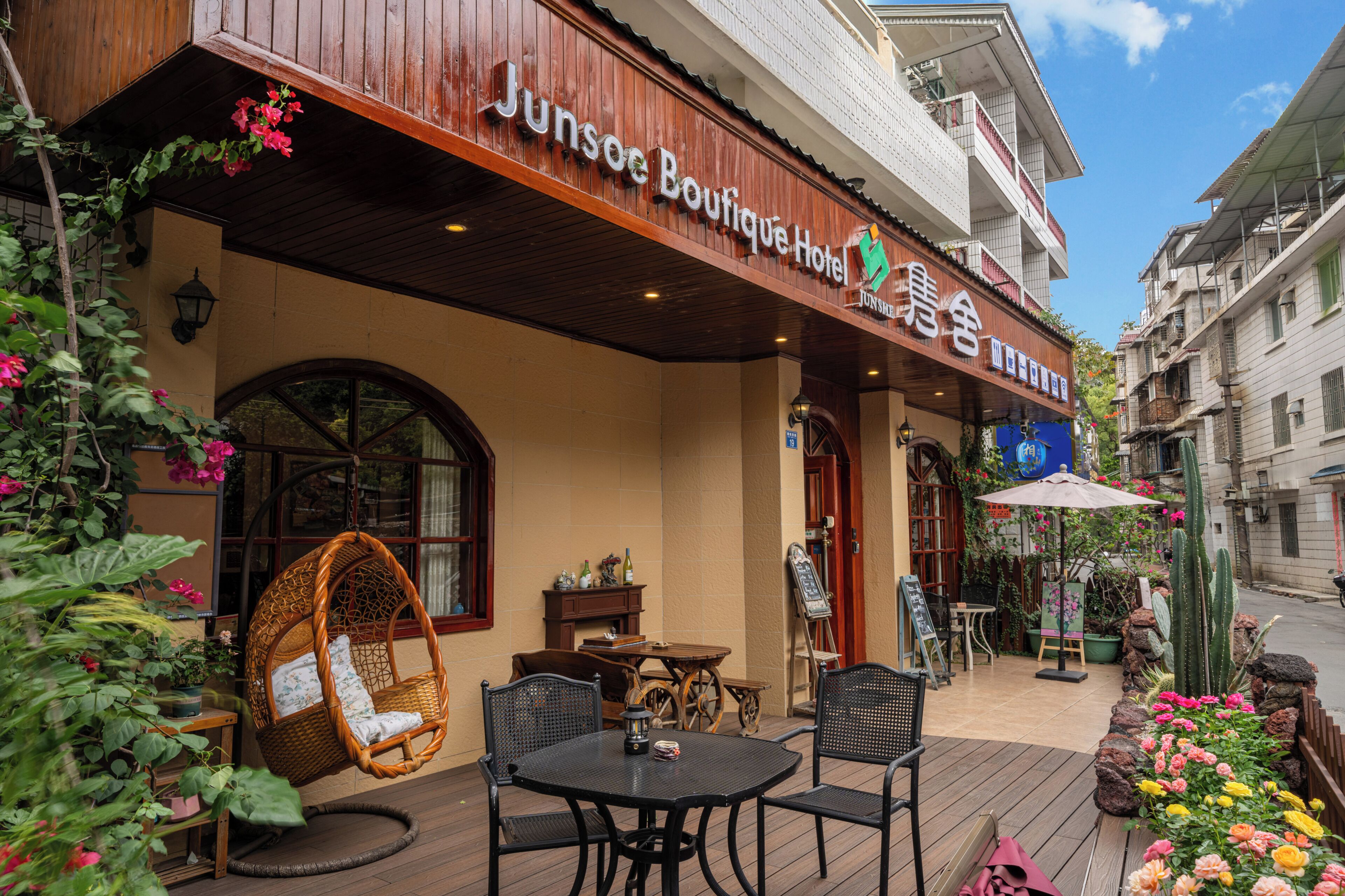 Junseo Boutique Hotel with outdoor seating, a hanging chair, and a cactus garden.