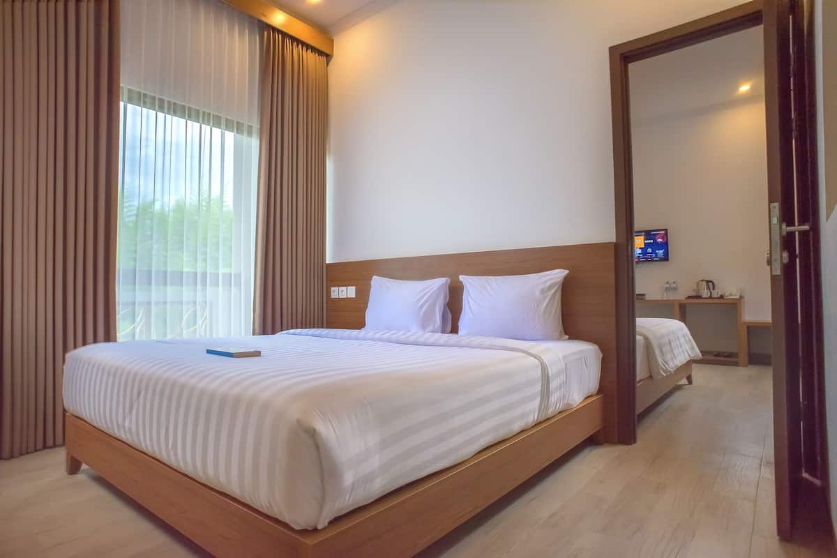 Deluxe kamer, 1 tweepersoonsbed, balkon | Een kluis op de kamer, een bureau, gratis wifi, beddengoed