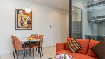 Executive Apartment, 2 Bedrooms | Living room | Flat-screen TV
