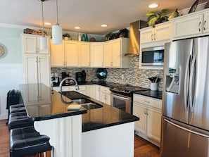 Private kitchen - Blue Sunset 4 Bedroom Home by RedAwning (Supply)