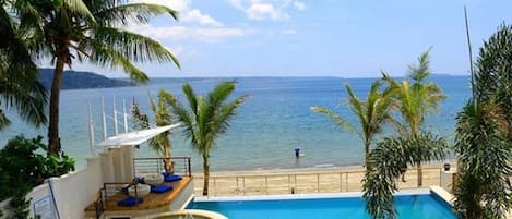 Outdoor pool, open 8 AM to 10 PM, pool loungers