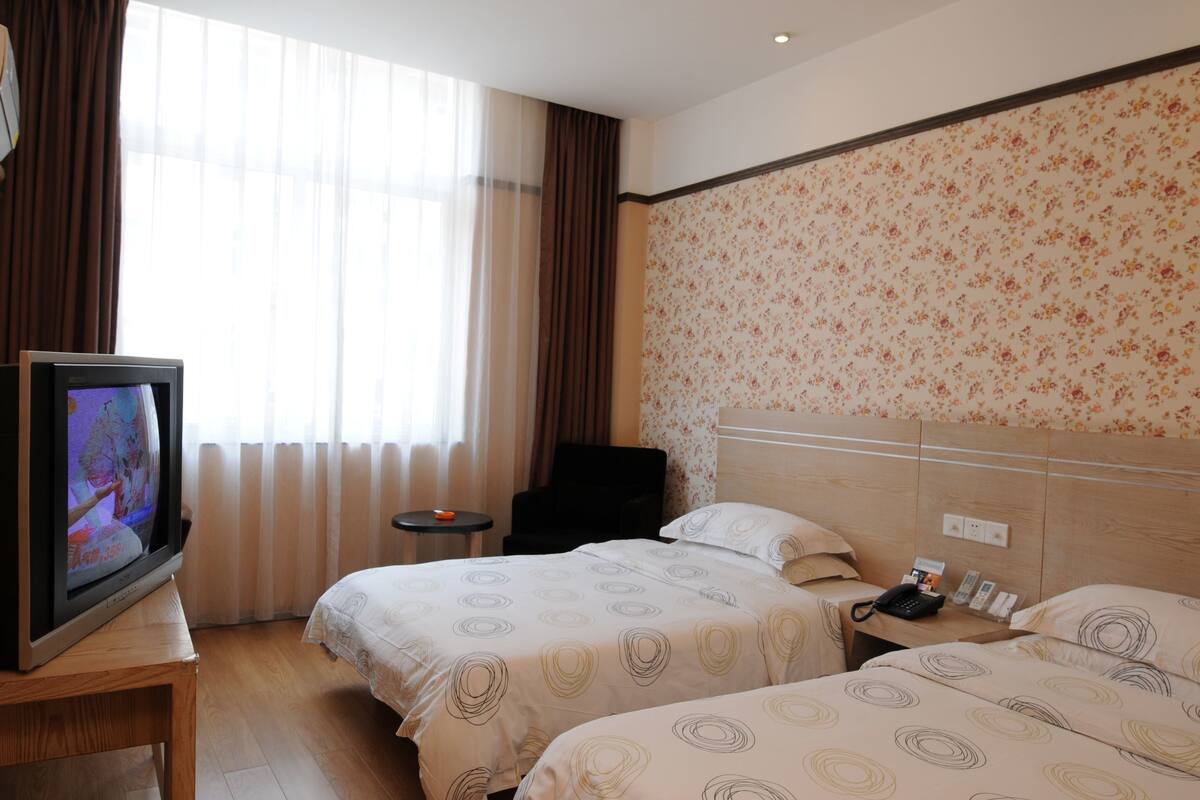 Twin Room A | Desk, blackout curtains, iron/ironing board, free WiFi