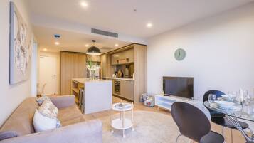 New Deshon, Designer 1 bedroom Apartment | Living area | Flat-screen TV