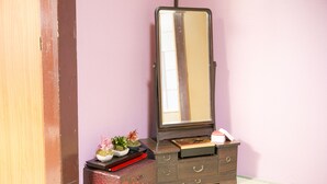 A wooden dresser with a mirror, drawers, and a small shelf with decorative items. - Wabi Sabi Kyoto (Kyoto)