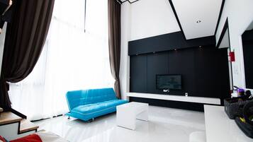 Family Duplex, 3 Bedrooms | Living area | 55-inch LCD TV with cable channels, TV, heated floors
