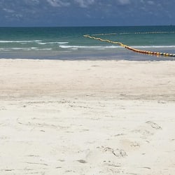 On the beach, white sand, beach towels