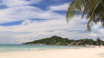 On the beach, white sand, beach towels