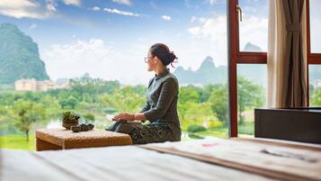 Guests can enjoy a peaceful view of the surrounding landscape from the comfort of their room.