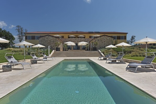Seasonal outdoor pool, a rooftop pool, pool umbrellas, pool loungers