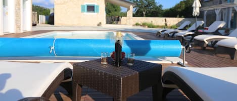 Seasonal outdoor pool, pool umbrellas, pool loungers