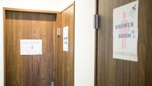 A wooden door with a sign indicating a sleeping room and a shower room for women only. - Guest House One More Heart at NARA BI - Hostel (Nara)