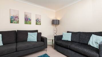 Premium Apartment, 2 Bedrooms, Ground Floor | Living room | Flat-screen TV, first-run movies