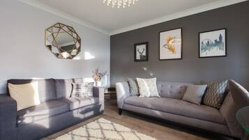 Premium Apartment, 2 Bedrooms, Ground Floor | Living area | 49-inch flat-screen TV with satellite channels, TV, books