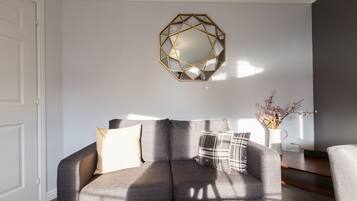 Premium Apartment, 2 Bedrooms, Ground Floor | Living area | 49-inch flat-screen TV with satellite channels, TV, books