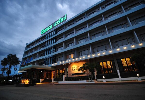 A multi-story hotel with a prominent sign reading "Swiss Hotel".