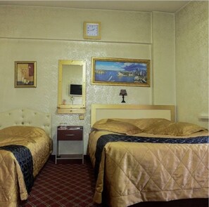 Familiekamer | 1 slaapkamer, luxe beddengoed, een bureau, een strijkplank/strijkijzer